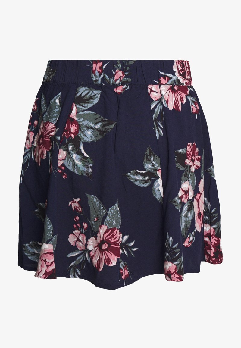 Jupe bleu marine avec taille élastique, ornée de grands motifs floraux roses et bordeaux avec des feuilles vertes.
