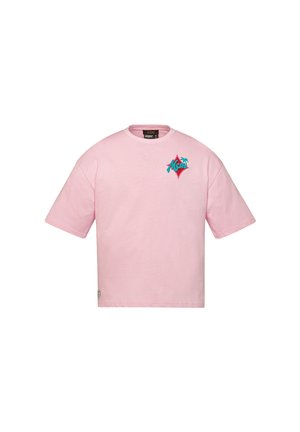 T-shirt en coton rose à manches courtes, coupe oversize. Avec un logo graphique coloré sur la poitrine et une petite étiquette sur le côté.