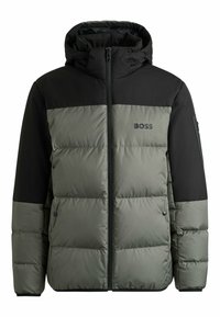 Puffer jacket in dark green and black, featuring a zip front, hood, and quilted texture. Brand logo "BOSS" displayed on the chest.