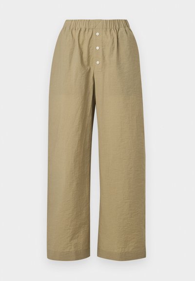Μπεζ παντελόνια με φαρδιά πόδια, με ελαστική μέση και τρία λευκά κουμπιά στο μπροστινό μέρος, φτιαγμένα από ελαφρύ υφασμάτινο ύφασμα με υφή.