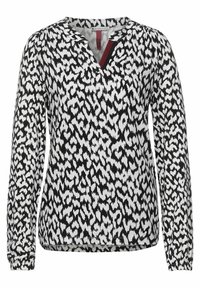 Halenka s dlouhým rukávem s černobílým abstraktním vzorem, výstřihem do V s vínovým akcentem a nařasenými manžetami pro těsné přilnutí.