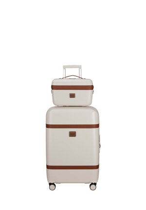 White, textured hard-shell luggage set with brown accents; includes a large suitcase and a smaller carry-on, both with wheels and handles.