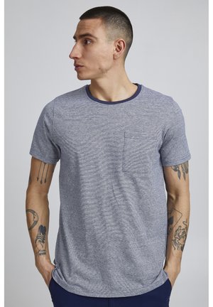 Striped crewneck t-shirt in blue and gray tones, featuring a chest pocket and short sleeves. Soft, textured fabric.