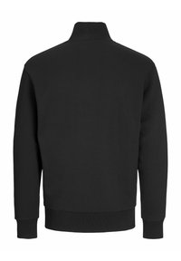 Black sweatshirt with a high collar, long sleeves, and ribbed cuffs and hem. Material appears soft and textured with a solid color.