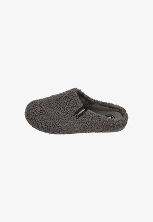 Gray slipper made of soft, textured fabric with a fuzzy appearance. Open back design and subtle branding tag visible on the side.