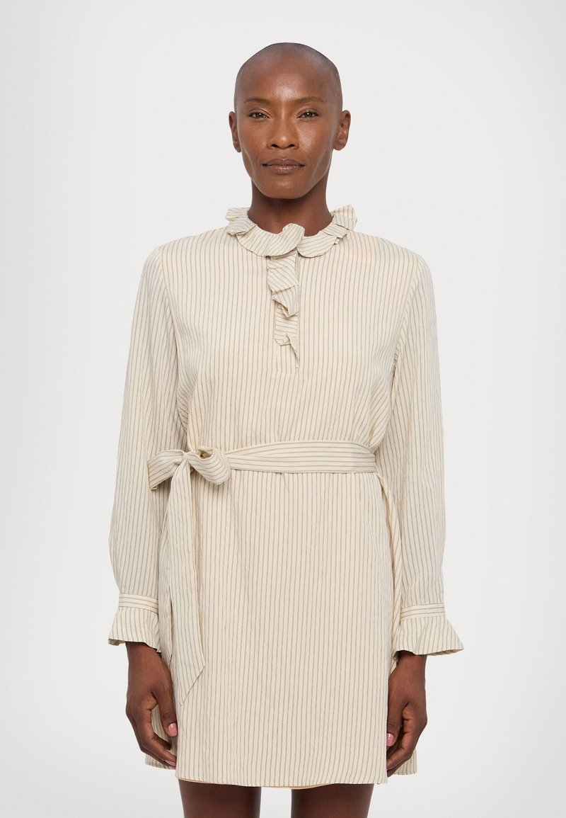 Striped dress in light beige with ruffled collar and cuffs, featuring a tie belt at the waist and a buttoned placket. Soft texture.
