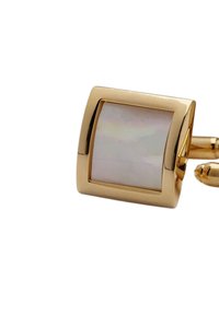 Guldtonad manschettknapp med en fyrkantig design och en polerad iriserande stencenter. Slät yta med en subtil lyster och rundade kanter.