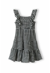 Robe vichy noir et blanc avec des bretelles à volants, un corsage froncé et un ourlet évasé à niveaux. Fabriquée en tissu léger.