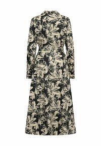 Bloemenprint jurk met lange mouwen, een kraag en een ceintuur in de taille. Zwarte basis met een crème bloemenpatroon, middellange uitvoering.