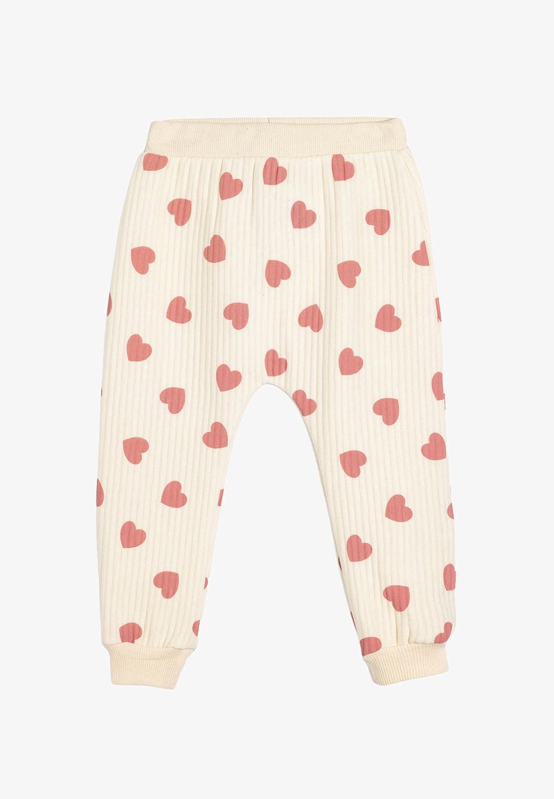 Cream-colored ribbed pants with pink heart patterns. Features an elastic waist and cuffed ankles. Soft texture suitable for casual wear.