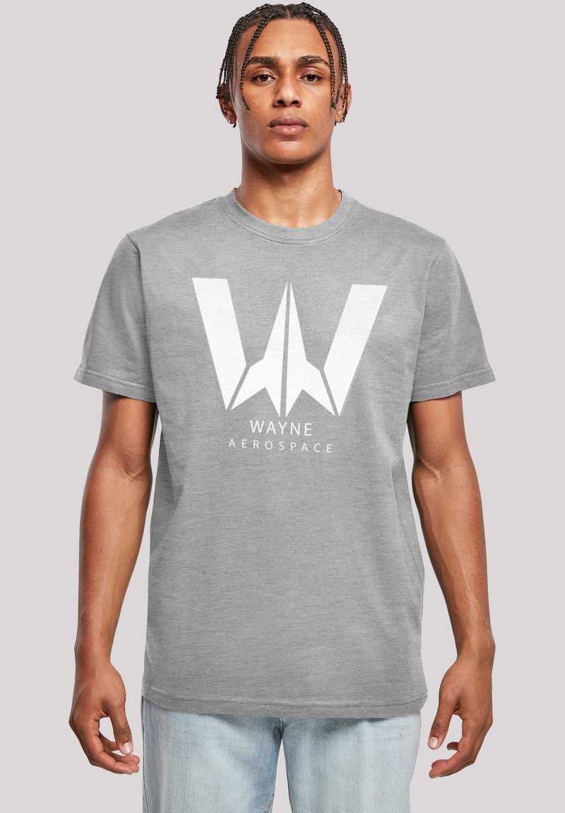 Grå bomull t-skjorte med et stort hvitt "W"-logo med et romfartsdesign, rund hals og korte ermer. Løs passform.