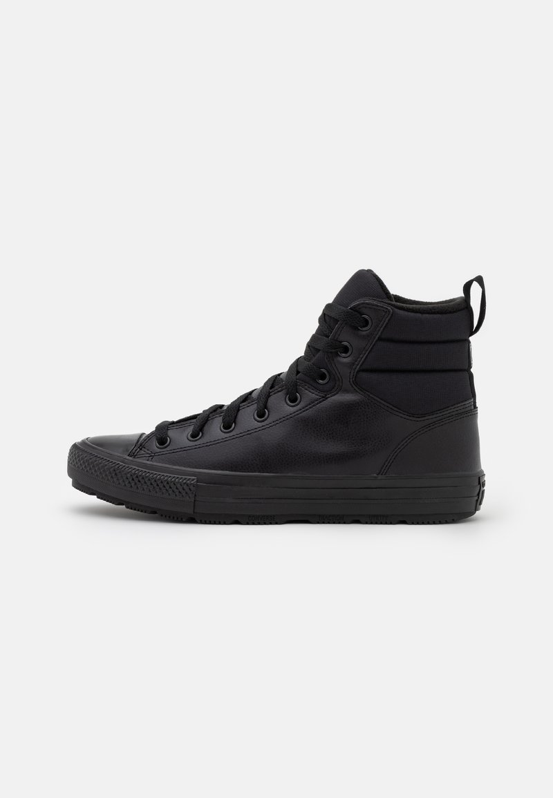 Black high-top sneakers featuring a smooth leather exterior, textured accents, round toe, lace-up design, and a padded collar for support.