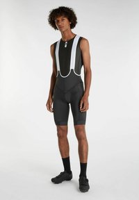 Čierne cyklistické šortky s trakom bez rukávov, s bielymi trakmi, priliehavým strihom a elastickou tkaninou pre pohodlie.