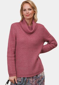 Pullover mit Kragen in einer pinken Nuance. Verfügt über ein strukturiertes Strickmuster und lange Ärmel, mit seitlichen Schlitzen für Bewegungsfreiheit.
