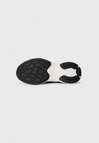 Black rubber sneaker sole with a patterned tread, featuring a distinct white midsole and defined sections for grip and flexibility.
