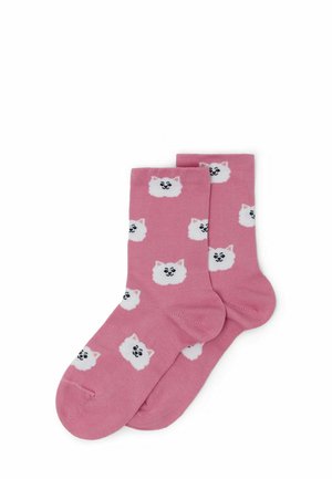 Calze di cotone rosa con un motivo ripetitivo di teste di cani soffici bianche con occhi e nasi neri. Texture liscia, forma standard delle calze.