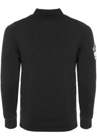 Sort langermet polo-shirt, lavet af bomuld, med krave og ribbede manchetter. Har et patch på venstre ærme med logo detaljer.