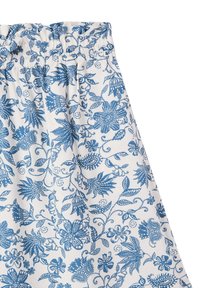 Gonna bianca in tessuto con motivo floreale blu, dotata di una vita elastica e di un design fluido. Texture con dettagli intricati.