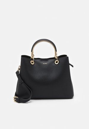 Bolso de cuero negro con textura, asas circulares chapadas en oro, correa de hombro desmontable y pequeño logo ALDO en el frente.