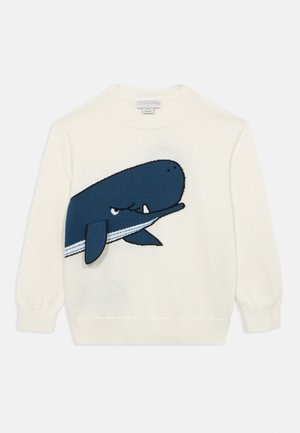 Pull à manches longues blanc avec un grand motif de baleine bleue à ventre rayé sur le devant.