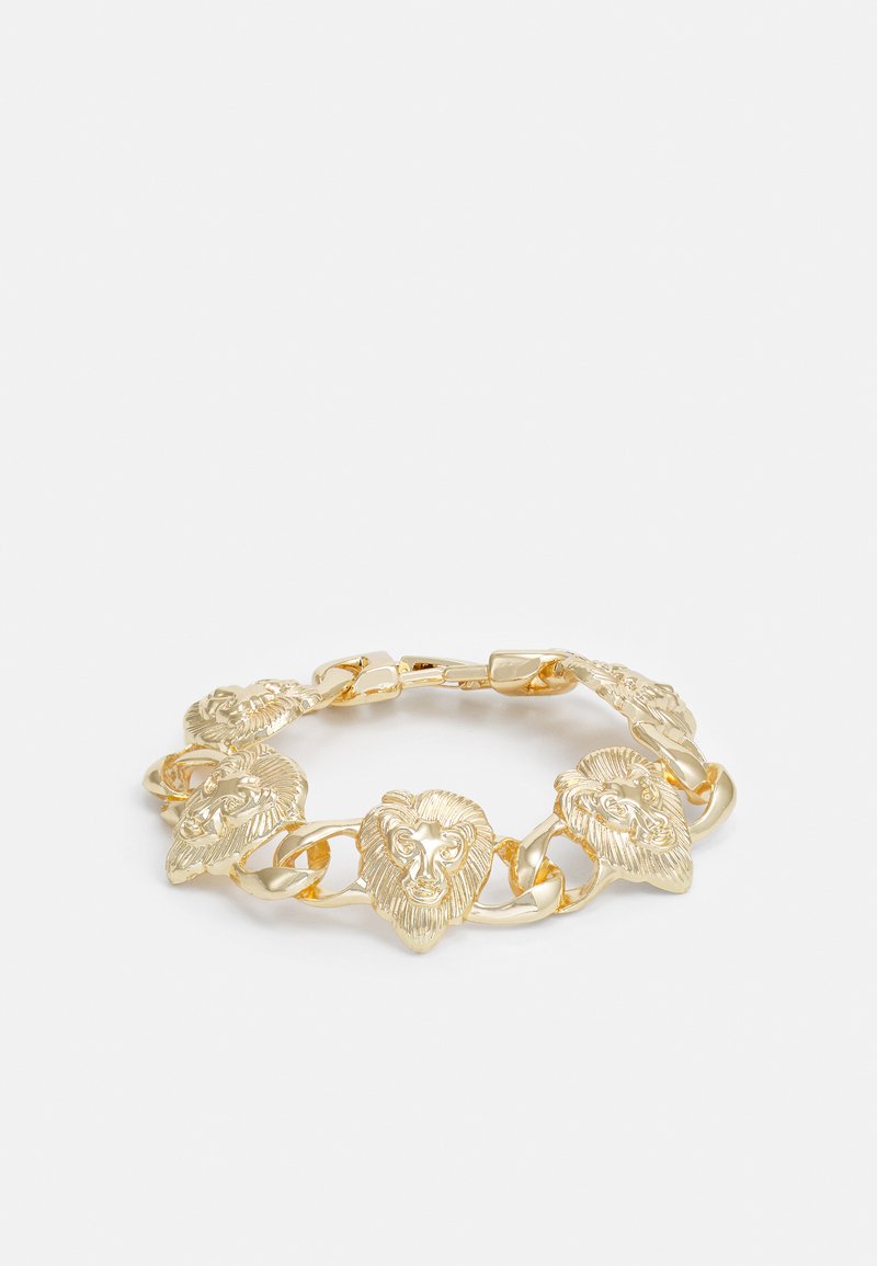 Kuldne käevõru, millel on lõvikoha motiivid, omavahel ühendatud siledate ketisegmentidega. Läikiv viimistlus ja detailne näo kujundus igal lingil.