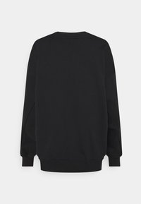 Black sweatshirt with a crew neckline, long sleeves, ribbed cuffs and hem, featuring a smooth texture and minimalistic design.