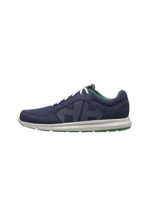 Navy athletic shoe with mesh upper, green inner lining, white laces, and a textured rubber sole. Features perforations for breathability.