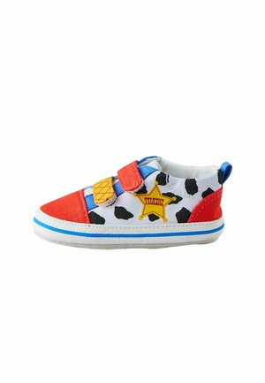 Small children's shoe with cow print, red toe and heel, blue accents, yellow sheriff star, and two Velcro straps.