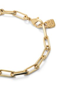 Bracelet en métal doré avec des maillons allongés et un fermoir à pince. Présente une petite étiquette gravée "UNO". Surface lisse, finition polie.