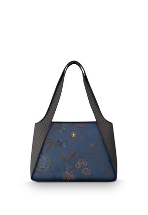 Blue handbag with floral pattern and dark patterned straps hanging upright on white background.