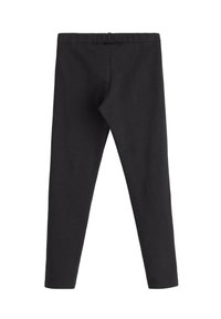 Svarte leggings lavet af blødt stof, med en elastisk talje og et tætsiddende design uden synlige sømme eller mønstre.