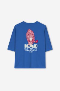 Blue cotton t-shirt featuring a red leopard graphic on the back, with "KAO" and text in both English and Japanese. Short sleeves, crew neck.