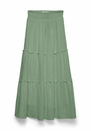 Jupe à volants vert clair avec ceinture élastique et détails subtils de volants, étiquetée "AWARE" en haut au centre.