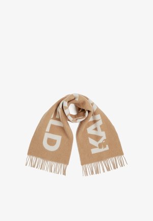 Beige scarf made of soft material, featuring large white lettering and fringed ends. The design is simple and functional.