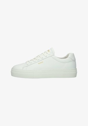 White leather sneakers with a smooth texture, rounded toe, flat sole, and minimalistic design. Features round laces and subtle branding.