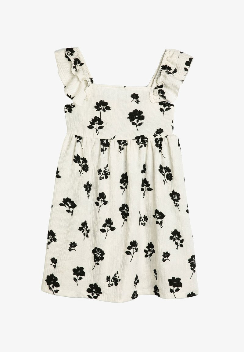 Weißes ärmelloses Kleid mit schwarzem Blumenmuster, Rüschenträgern, strukturiertem Stoff und A-Linien-Silhouette. Verfügt über ein gerafftes Taillendesign.