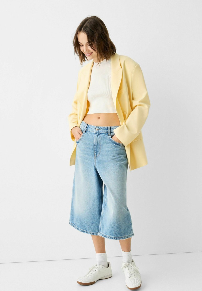 Bershka Halflange jas geel Bershka Halflange jas geel