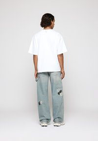 EIGHTYFIVE PATCHED CARPENTER - Tesarske kavbojke - island blue