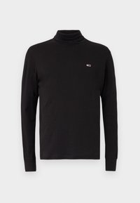Black long-sleeve turtleneck shirt made of cotton, featuring a small logo on the chest, fitted design, and ribbed cuffs.