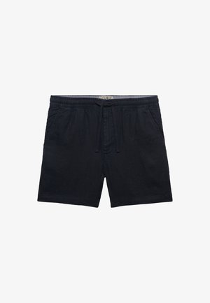 Sorte elastiske shorts med lommer foran og en snor bundet i midten, vist på en hvid baggrund.