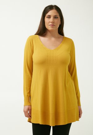 Langärmliger gelber Pullover mit V-Ausschnitt, strukturiertem Vorderteil und lockerer Passform, mit gerippten Akzenten an den Bündchen und dem Saum.