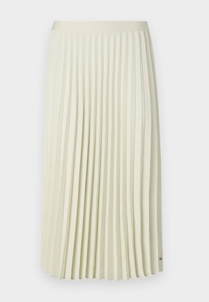 Pleated midi skirt in light cream fabric with a smooth waistband and uniform vertical folds. Features a small branded accent near the hem.