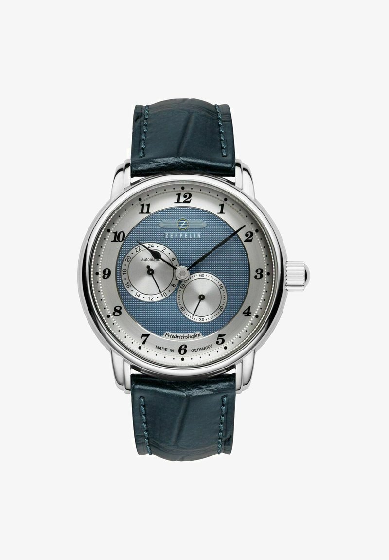 Automatic wristwatch with a silver and blue textured dial, silver numerals, and a dark blue leather strap with a crocodile pattern.