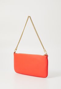 Red leather clutch with a zip closure and gold chain strap, featuring a smooth texture and minimalistic design.