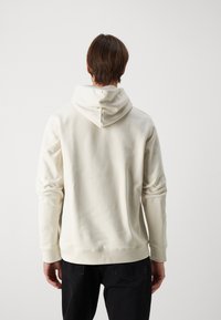 Tommy Jeans BADGE HOODIE UNISEX - Jersey con capucha - newsprint