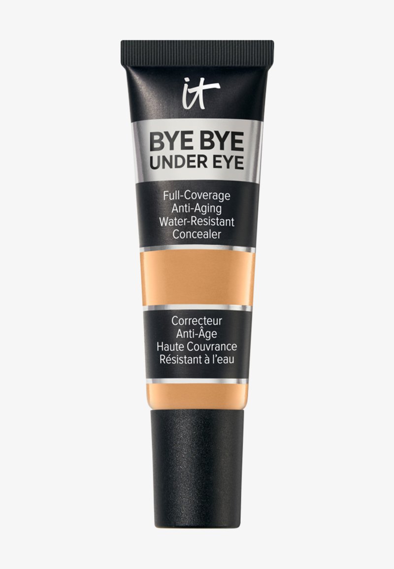Tube de correcteur IT Bye Bye Under Eye à couvrance totale, anti-âge, résistant à l'eau, avec un bouchon noir et une couleur de produit beige visible.