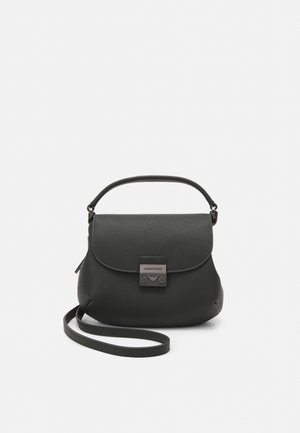Black leather handbag with a rounded bottom, flap closure, embossed logo detail, and a thin shoulder strap. Textured surface.