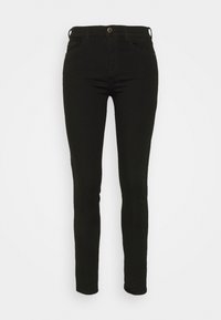 Svarta denim skinny jeans med en klassisk femficksdesign, bälteshällor och stängning med framknapp. Slät textur och figurnära silhuett.