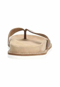 Sandales en cuir brun avec une semelle intérieure en suède beige doux et une semelle extérieure en caoutchouc blanc, présentant un design lisse et plat avec un minimum de coutures.