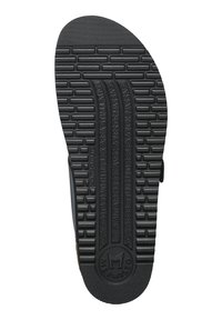 Semelle de chaussure en caoutchouc noir avec une surface texturée, présentant des rainures horizontales et verticales, logo de la marque "Mephisto" et détails des zones de massage.